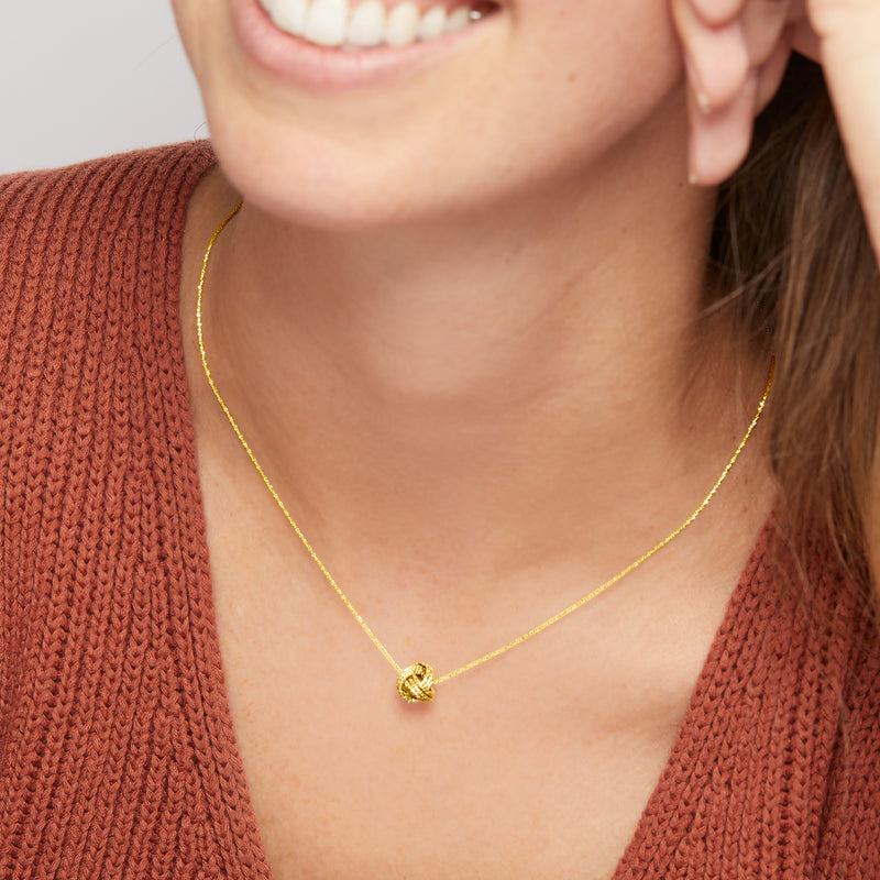 14kt yellow gold textured love knot pendant necklace on thin chain
