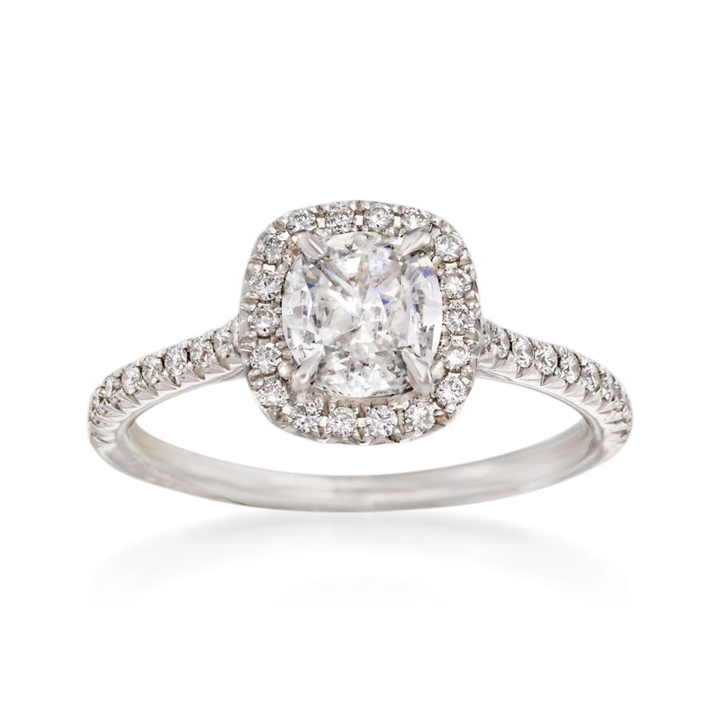 White gold diamond engagement ring with oval center stone and diamond halo