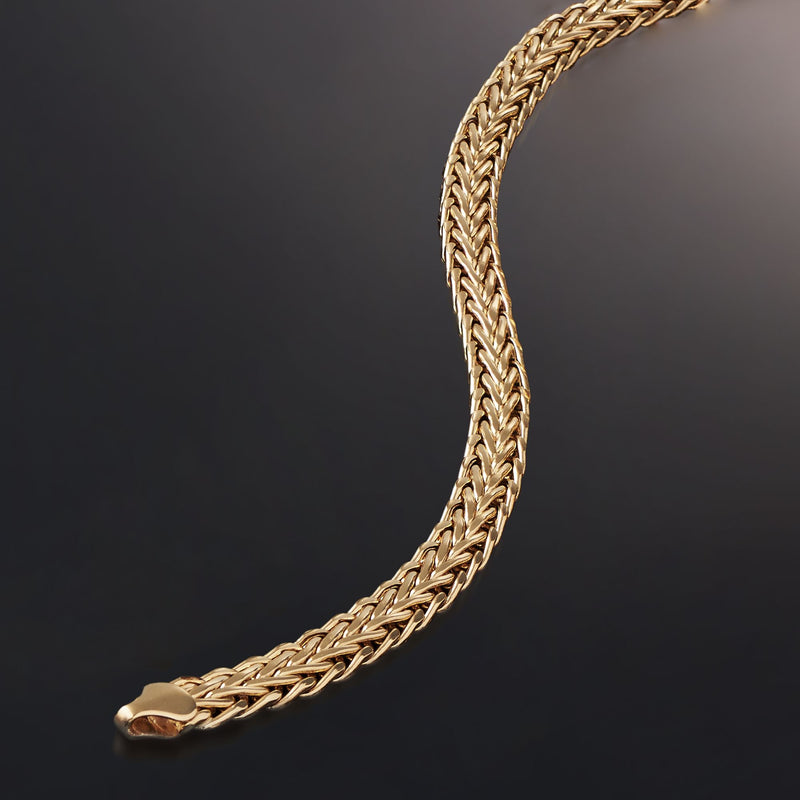 Yellow gold wheat-chain bracelet with clasp end detail