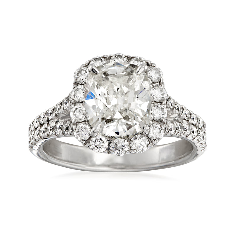 White gold diamond engagement ring with large center round stone and halo accents