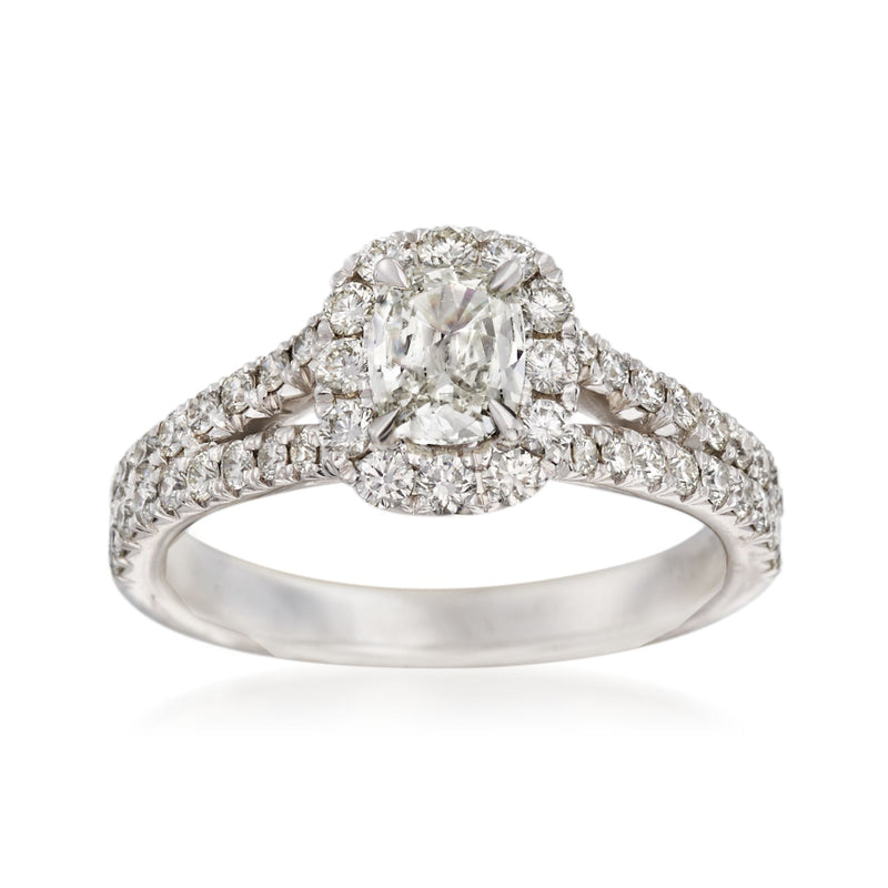 14kt white gold diamond engagement ring with oval center stone and round halo