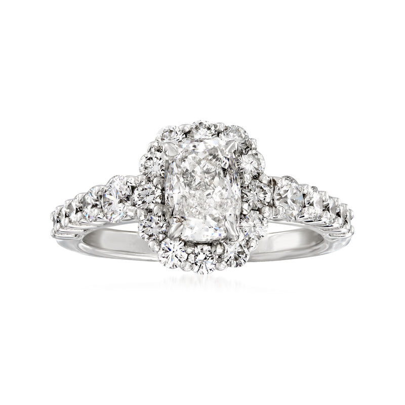 Cushion-cut diamond halo engagement ring in 18kt white gold, prong-set center