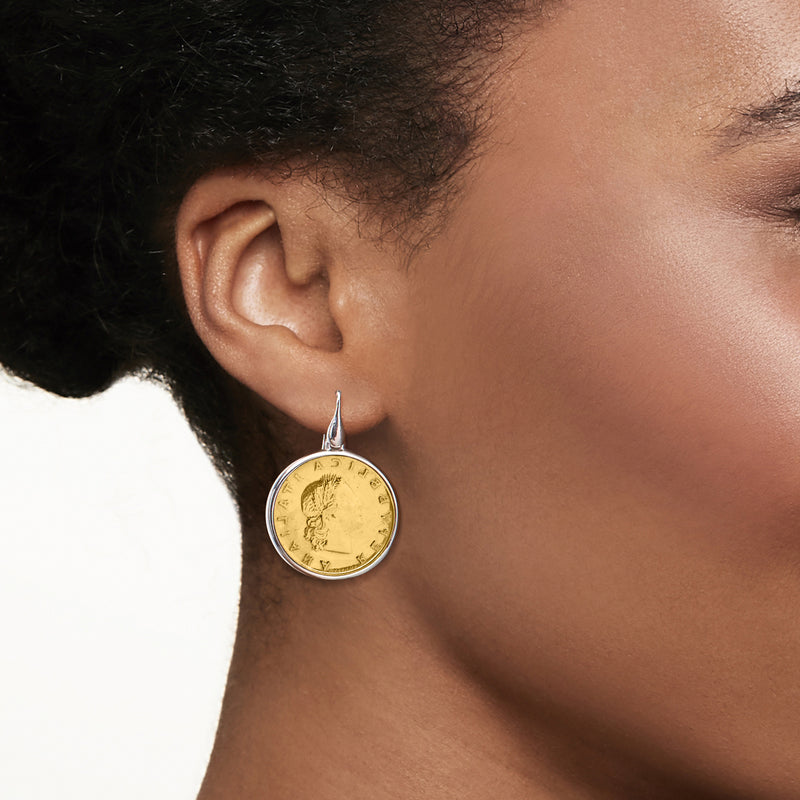 Sterling silver lira coin drop earring on ear with gold-toned coin and earwire