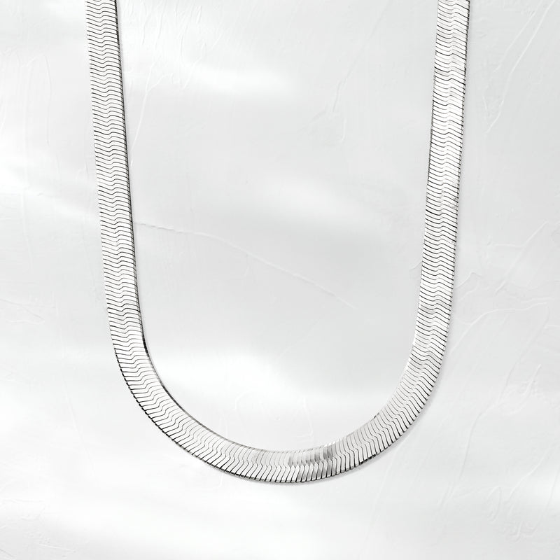Sterling silver herringbone necklace, flat textured links in a long U-shaped view