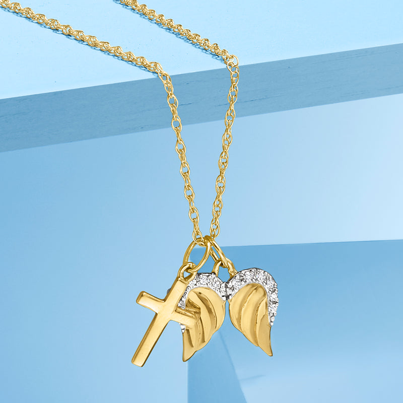 Yellow gold cross and angel wings pendant necklace with diamond halo detail