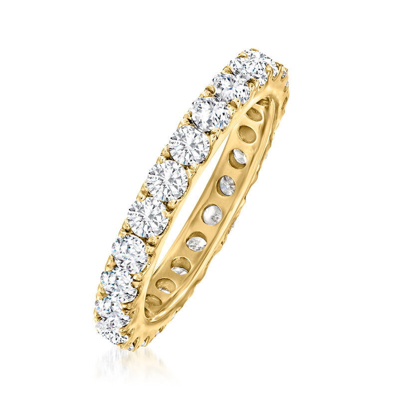 Side view of 14kt yellow gold diamond eternity band with round bezel-set stones