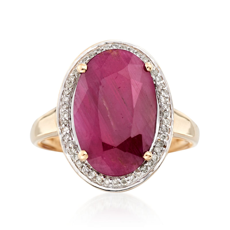 Oval ruby halo diamond ring in 14kt yellow gold with pave border