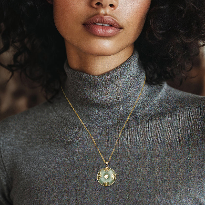 Gold-over-sterling jade pendant necklace with round charm and butterfly details