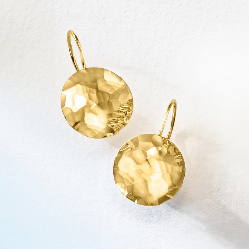 Hammered yellow gold disc drop earrings, angled view on earwires