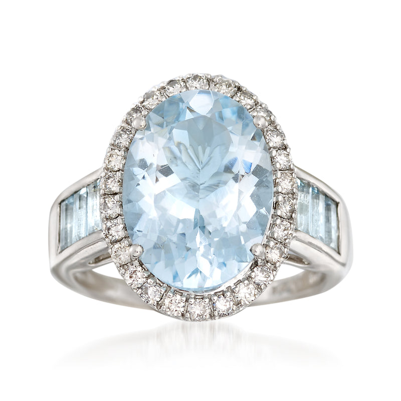 Oval aquamarine center stone haloed with diamonds 14kt white gold ring