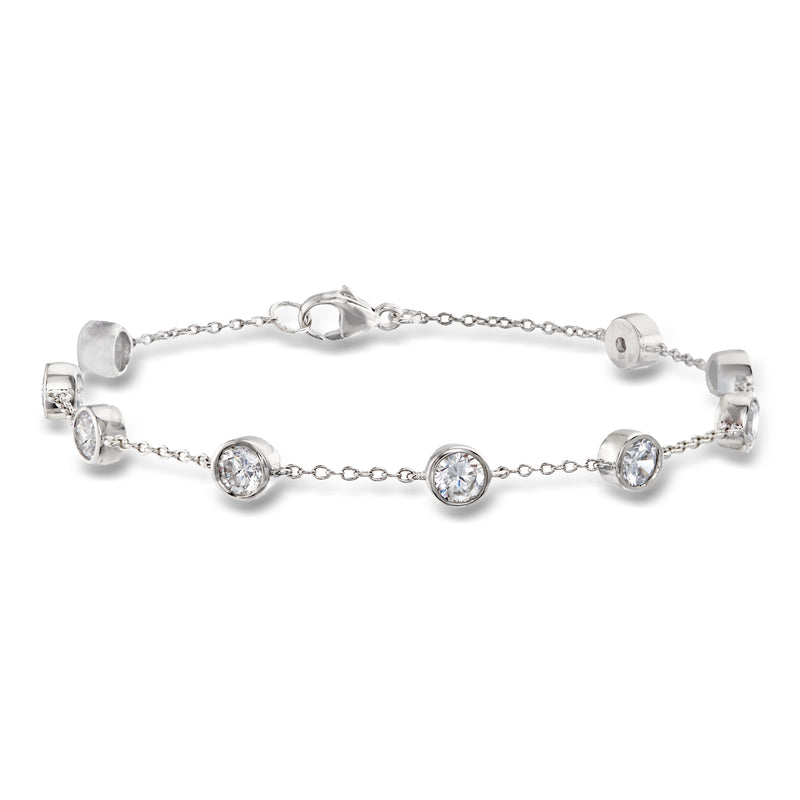 Sterling silver CZ station bracelet with round bezel-set stones and toggle clasp
