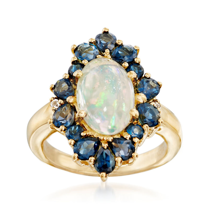 14kt gold over sterling ring with oval opal center and blue topaz halo accents