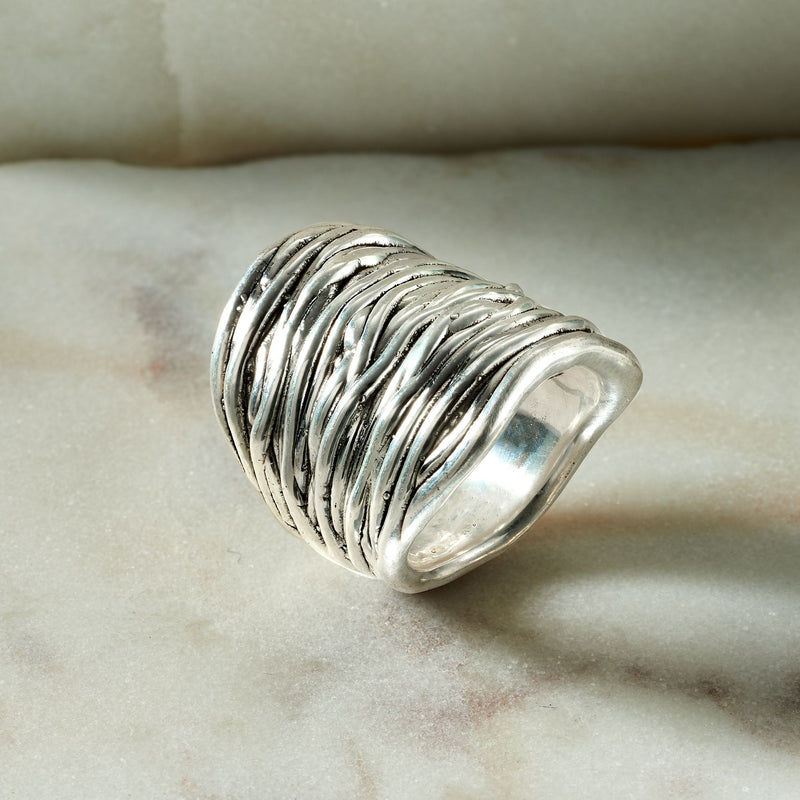 Sterling silver wrap ring with ribbed wavy rows, wide band, polished inner edge
