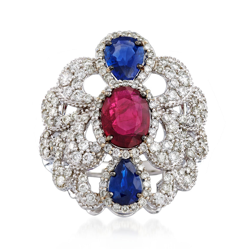 Scalloped diamond ring in white gold with oval blue and marquise red gemstones