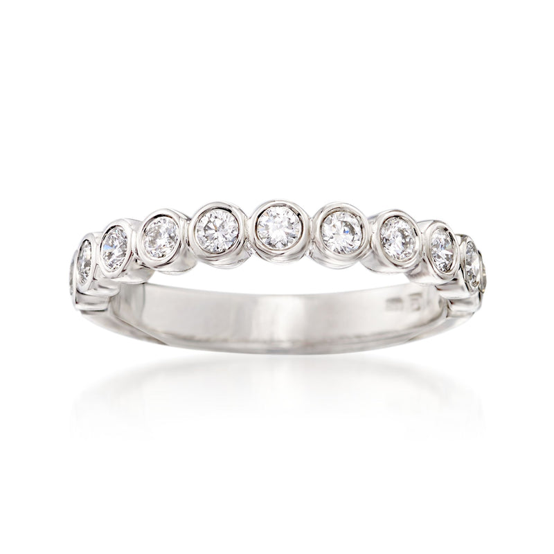 14kt white gold diamond wedding ring with bezel-set round stones along the band