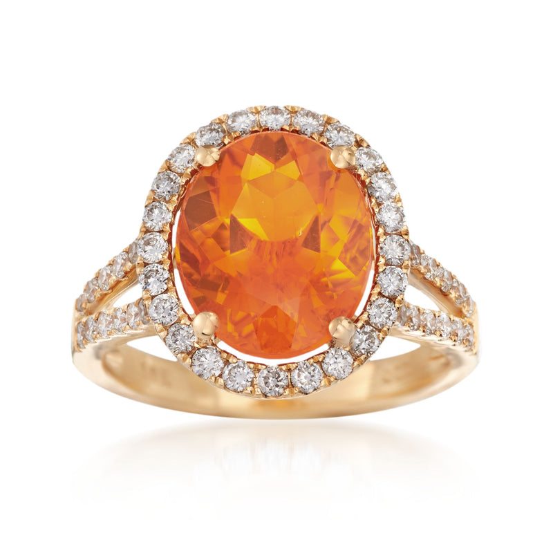 18kt yellow gold ring with oval orange fire opal center and diamond halo