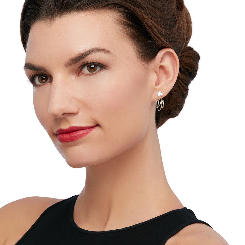 Woman wearing 14kt yellow gold hoop earring jackets with small round stones