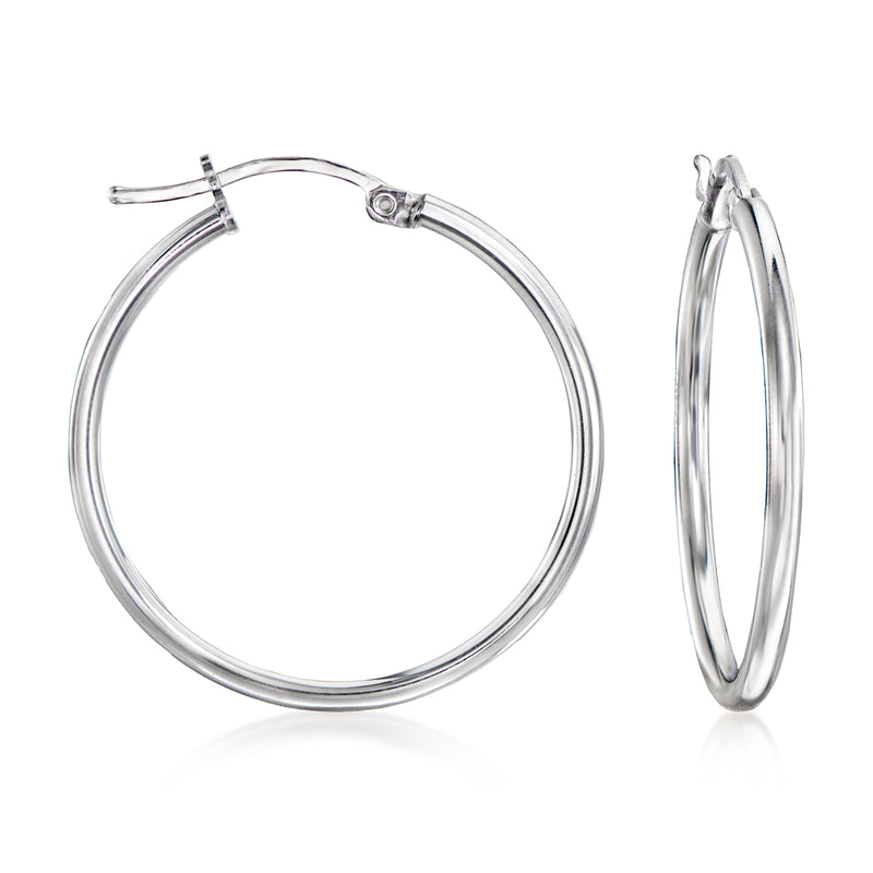 Sterling silver hoop earrings with small round hoops and visible hinged clasp