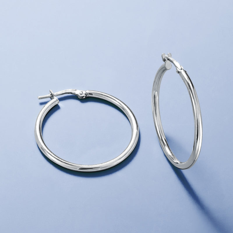 Sterling silver hoop earrings shown front and side, round hoops with hinged closures