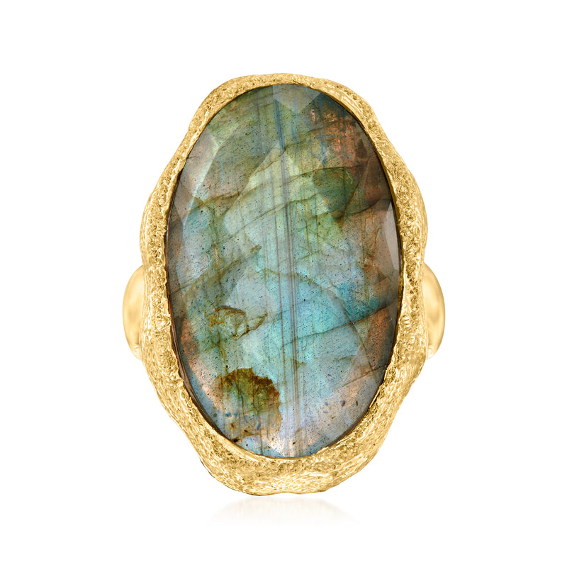 Oval labradorite ring in gold-tone bezel with blue-green flash, textured oval frame