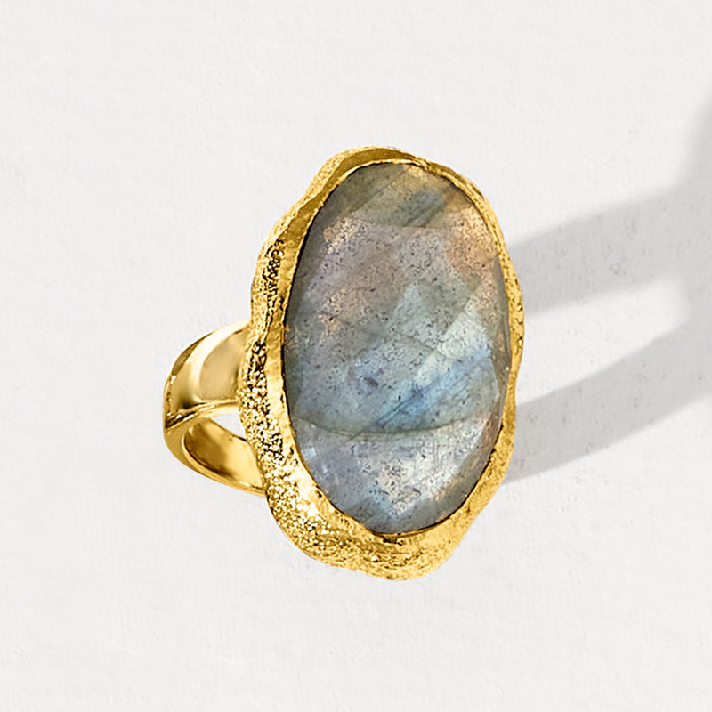 Labradorite oval ring with gold-tone bezel, side view of textured prongless setting