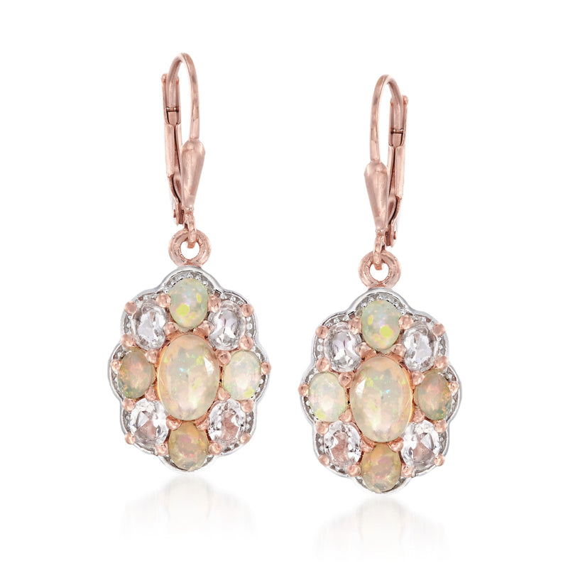 Opal cluster leverback earrings in rose gold; oval opal center with clear gemstone halo