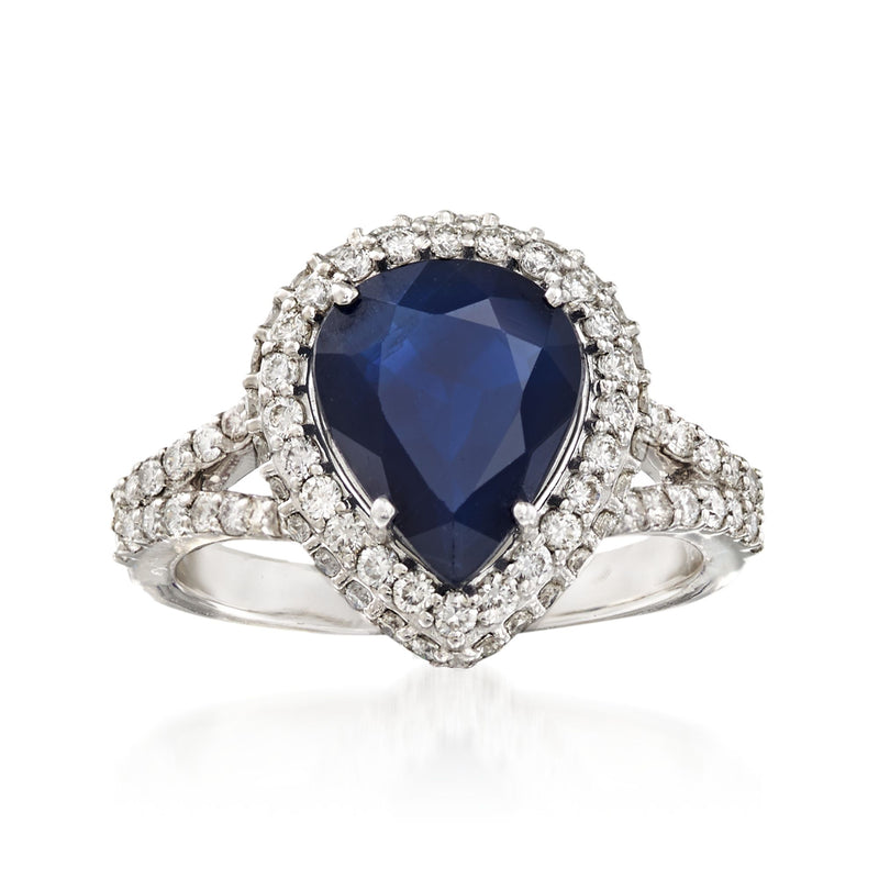 18kt white gold sapphire and diamond halo ring with oval blue center stone