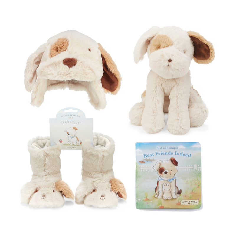 Baby plush gift set with beige puppy hat, stuffed dog, and board book