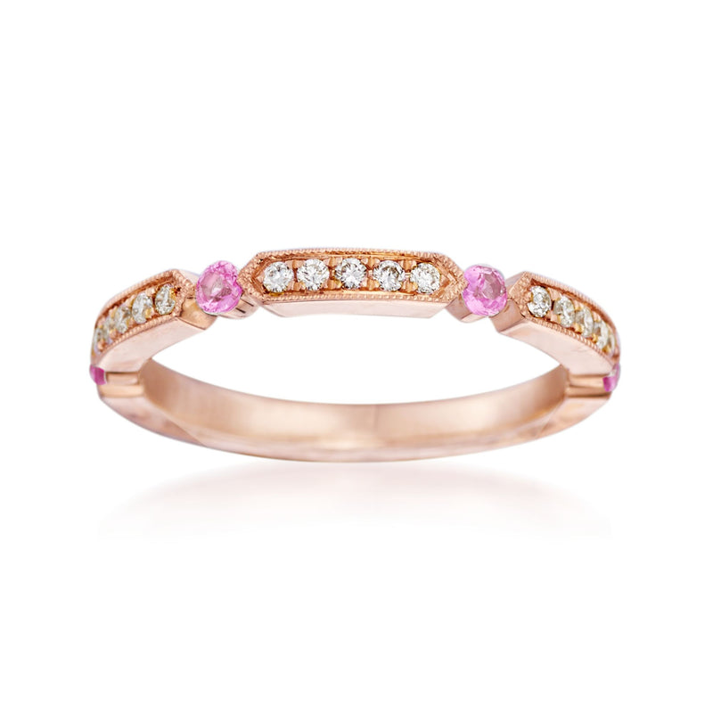 14kt rose gold wedding ring with three pink sapphire stones and diamond side accents