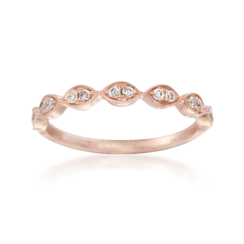 14kt rose gold diamond wedding ring with five round stones in a wave