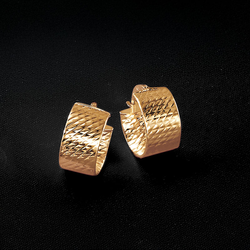 Textured 14kt yellow gold huggie hoops with woven-like diamond pattern, small hinged