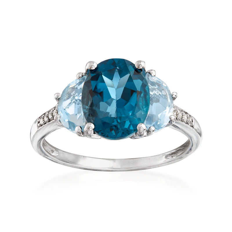 Sterling silver ring with oval blue topaz center and small diamond accents