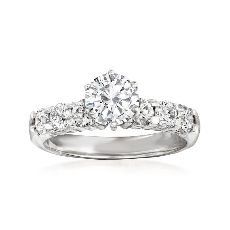 Certified diamond ring in 14kt white gold with round center stone and pavé side diamonds