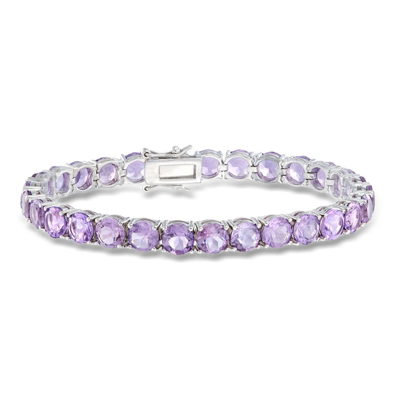 Sterling silver amethyst tennis bracelet with oval purple stones and central clasp