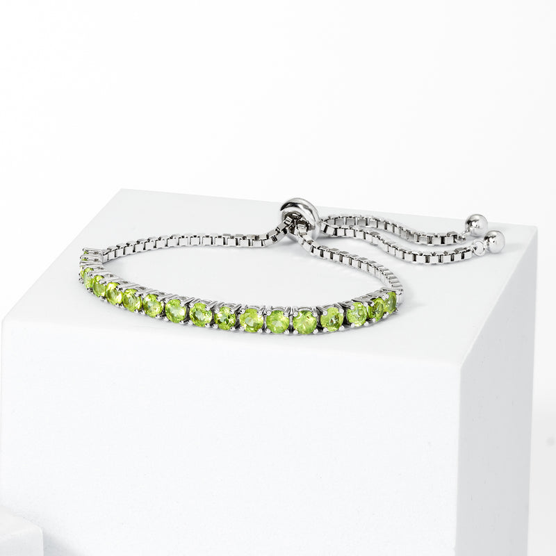 Sterling silver bolo bracelet with a row of green peridot oval stones