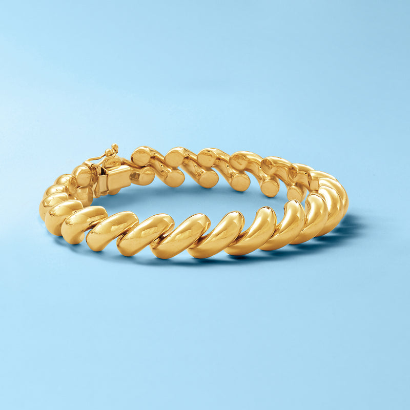 14kt yellow gold bracelet with rounded ridged links, hinged clasp visible