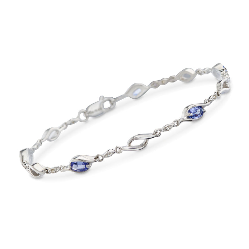 Sterling silver tanzanite swirl link bracelet with oval blue gemstones and white topaz accents