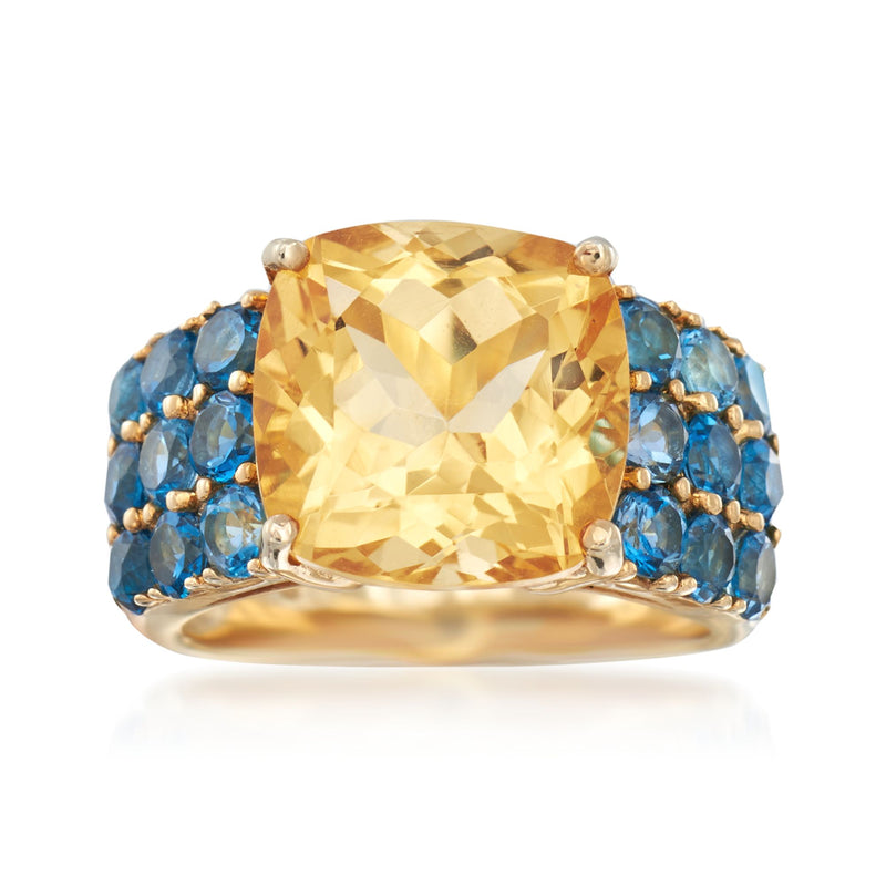 Cushion-cut citrine ring with blue topaz accents, gold-tone band