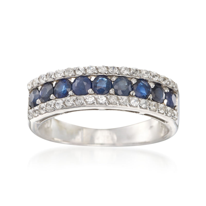 Sterling silver ring with blue sapphire-style center stones and clear side accents