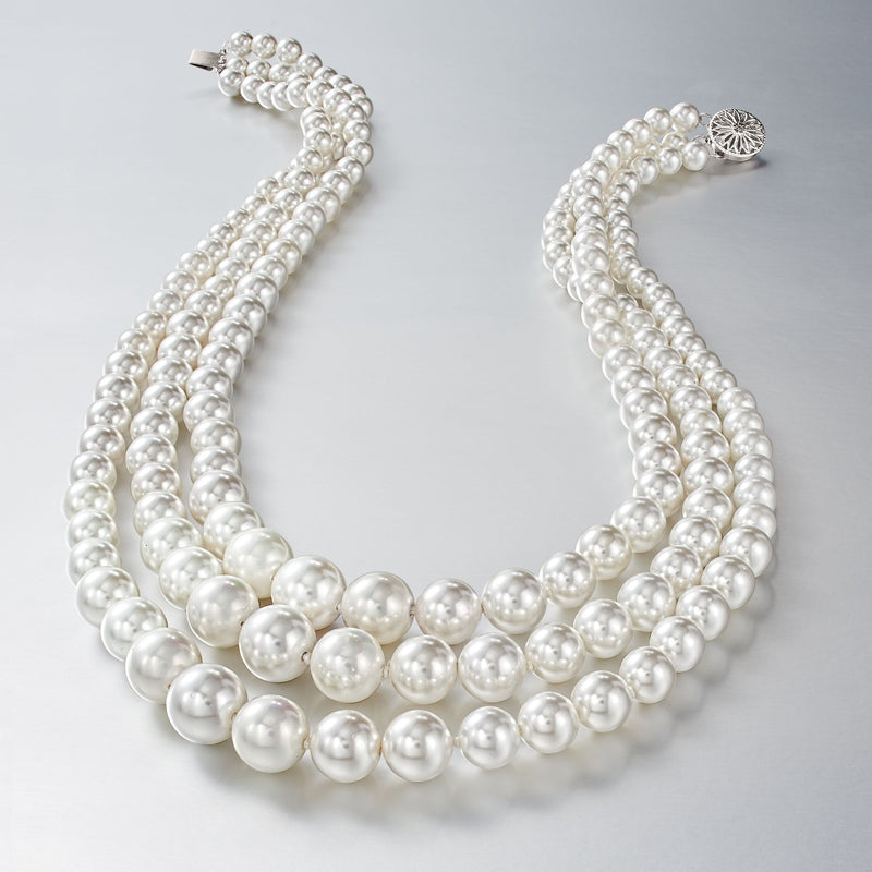 Graduated shell pearl three-strand necklace in a white pearl double row