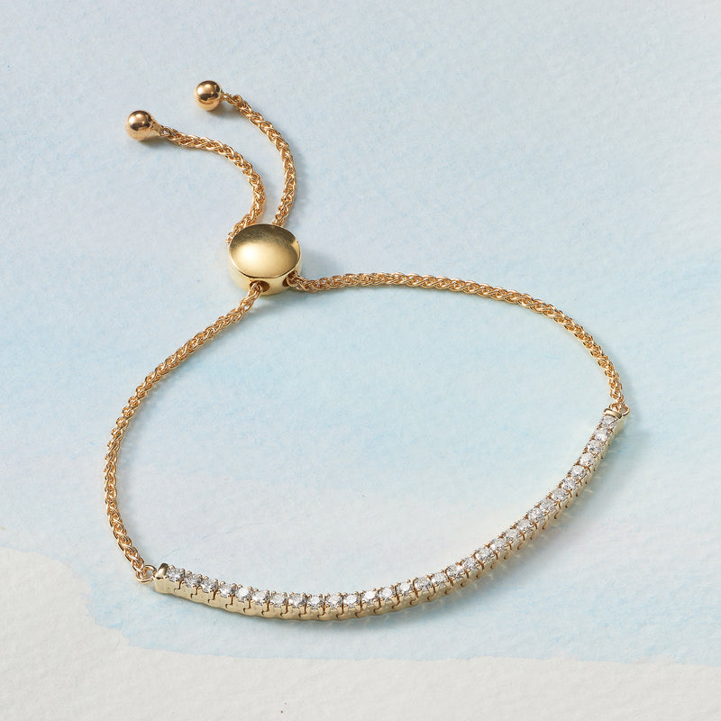 Yellow gold diamond bolo bracelet with adjustable chain and pavé stone row