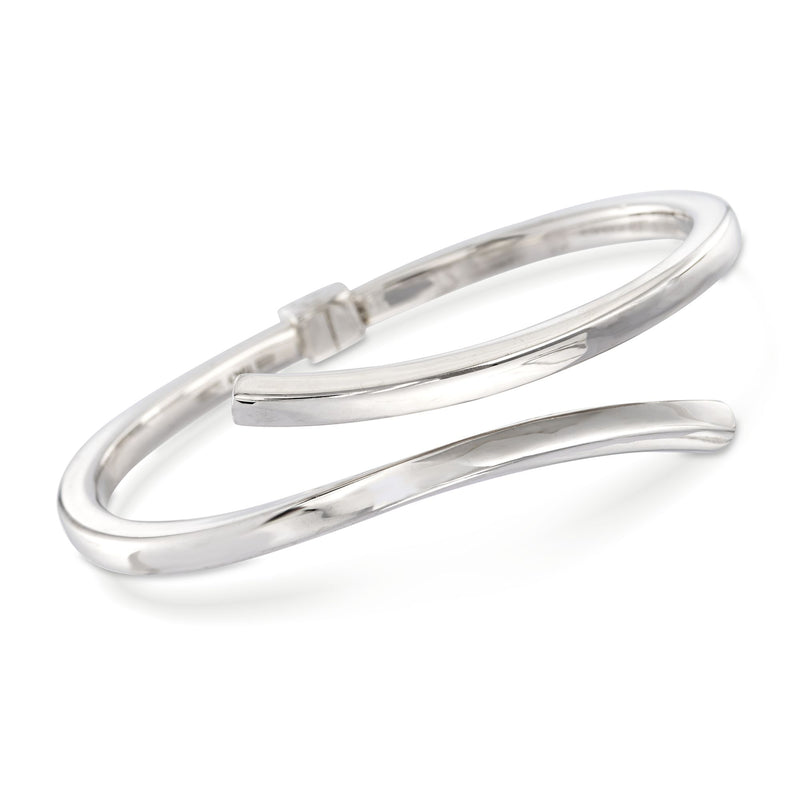 Sterling silver bypass bangle bracelet with hinged clasp and polished finish