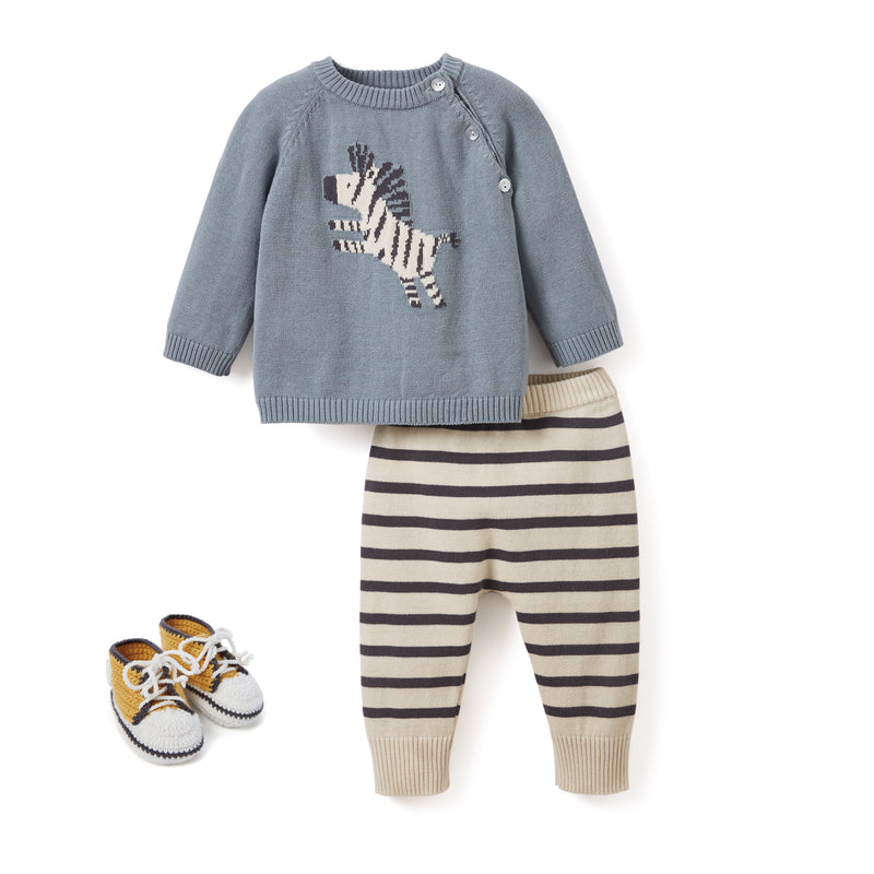 Baby clothing set with blue zebra sweater, striped pants and matching knit booties