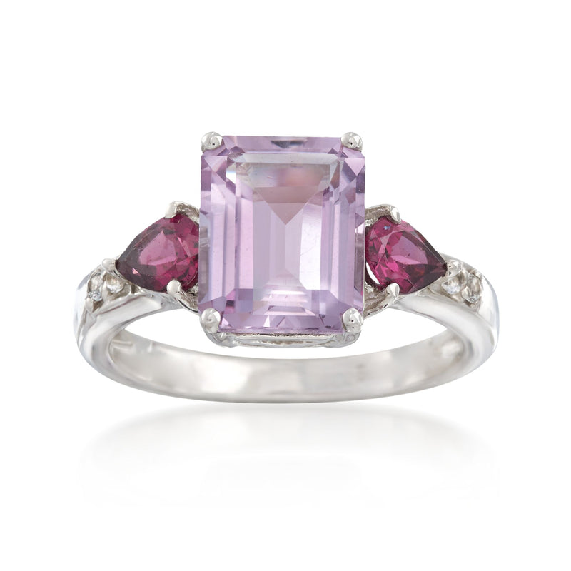 Sterling silver ring with light purple rectangular center stone, pink side stones