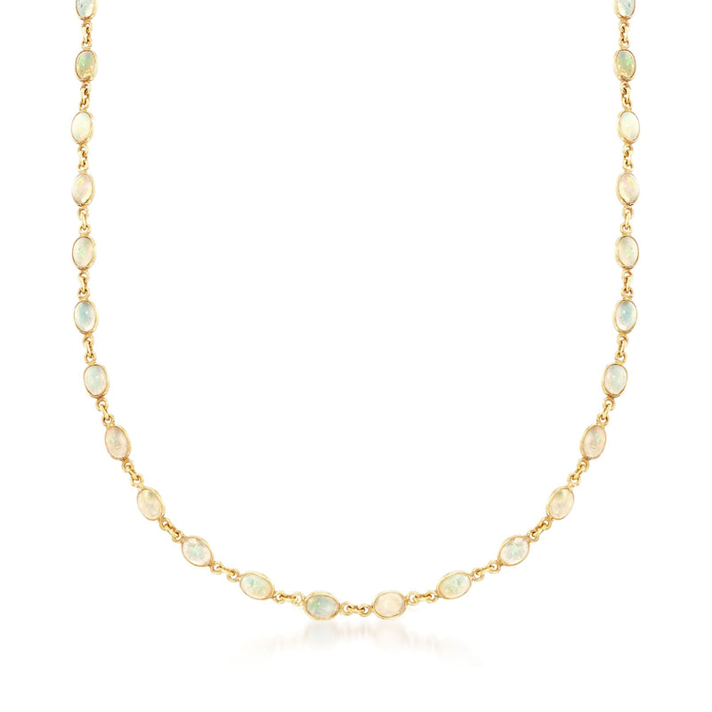 Gold over sterling opal station necklace with small oval opal links, delicate chain.