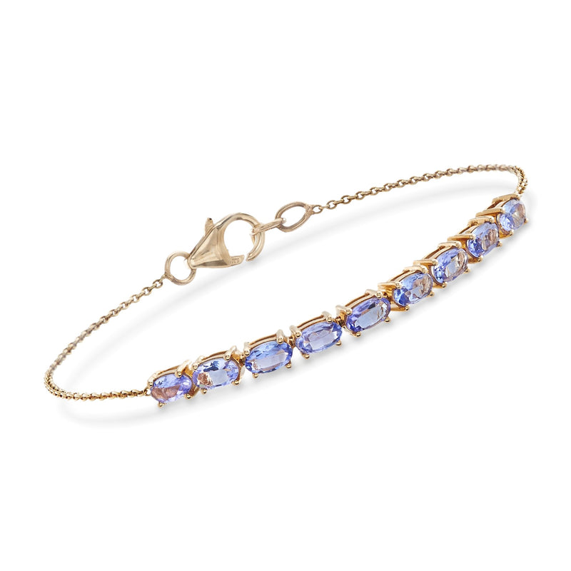 14kt yellow gold tanzanite tennis bracelet with oval blue gemstones and clasp
