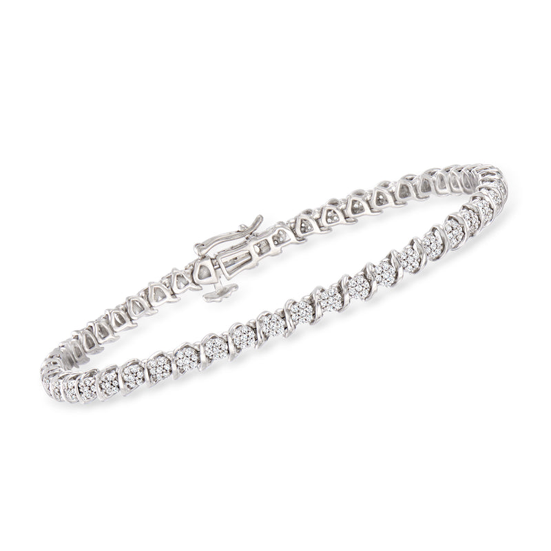 Sterling silver diamond tennis bracelet with mixed round and baguette cluster stations