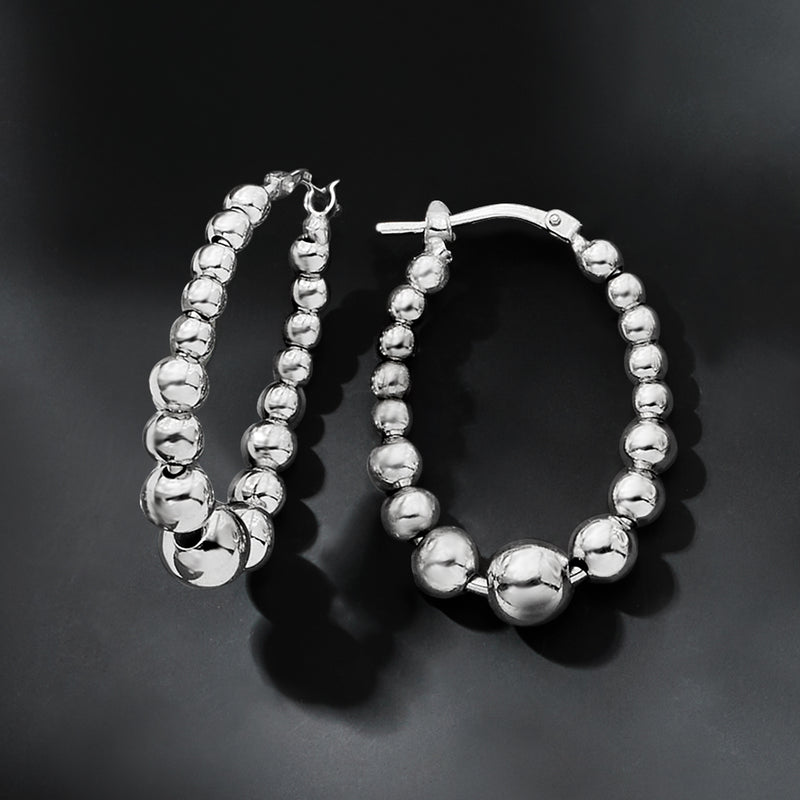 Sterling silver oval hoop earrings with round bead strands, side view pair