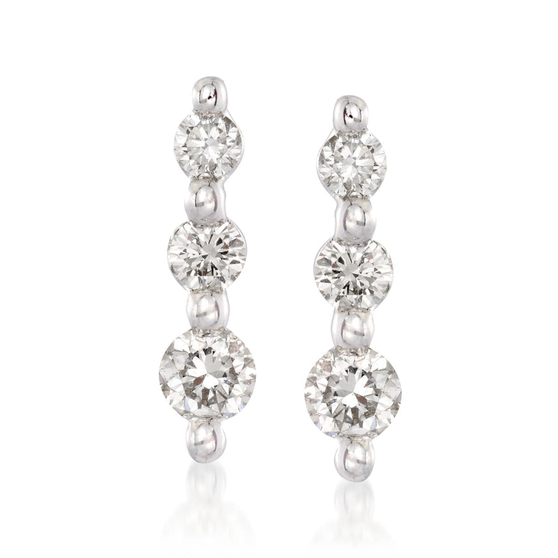 Graduated diamond drop earrings in 14kt white gold, three round stones in a vertical drop