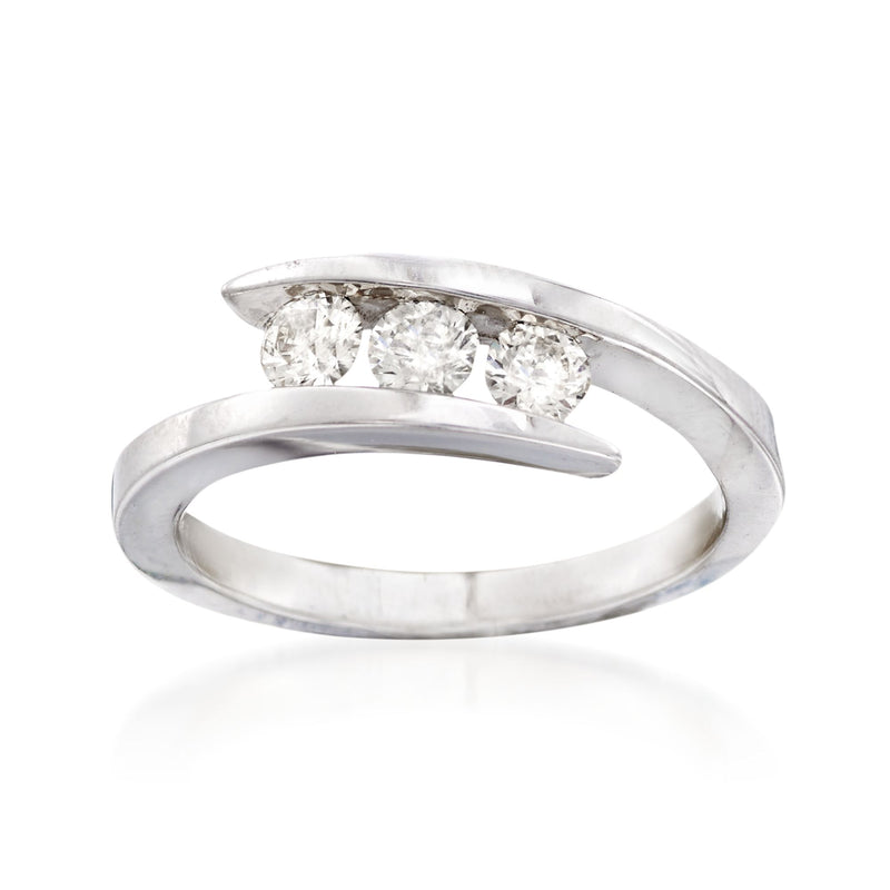 14kt white gold three-stone bypass ring with three round diamonds